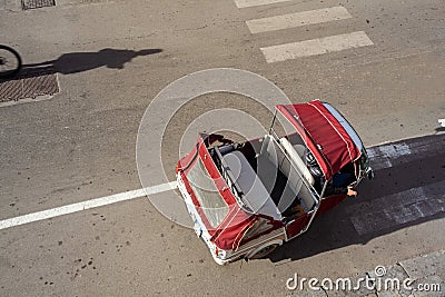 A traditional 3-wheeled Piaggio Ape taxi parked in the center of Palermo, Sicily Stock Photo