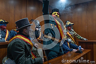 Traditional winter festival and masquerade 'Els Enfarinats'. Ibi, Spain. Theater where the rebel Editorial Stock Photo