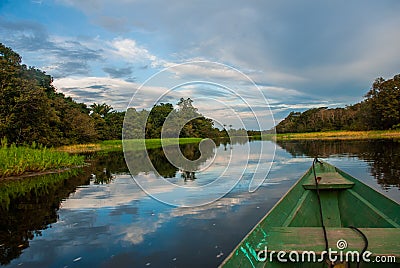 Traditional wooden boat floats on the Amazon river in the jungle. Amazon River Manaus, Amazonas, Brazil Stock Photo