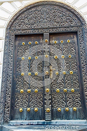 Traditional wooden carved door in Stone Town, Zanzibar, Tanzania Editorial Stock Photo