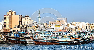 Traditional wooden Dhows moored on the creek in Dubai in the district Deira Editorial Stock Photo