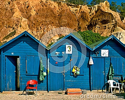 Blue fisherman huts at the Albufeira Oura beach, Algarve - Portugal Stock Photo