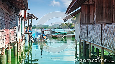 Traditional wooden house and Modern house roadside of fisherman village. Stock Photo