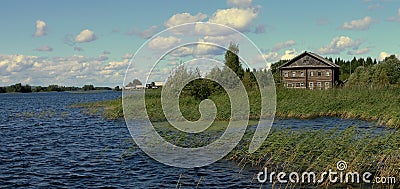 Traditional wooden house on the shore of Lake Onega, Russia Stock Photo