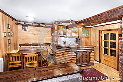 Traditional wooden interior with table and fixtures - mountain resort Stock Photo