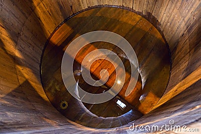 Traditional wooden mash tun at single malt whisky distillery in Stock Photo