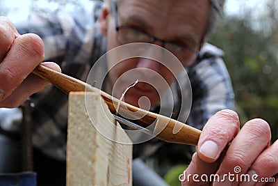 Traditional woodworker using antique boxwood spokeshave Stock Photo