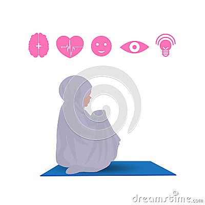 Traditionally clothed muslim woman making a supplication salah while sit down Stock Photo