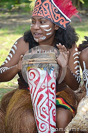 Traditonal Musician of Papua: Girl Editorial Stock Photo