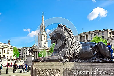 Trafalgar square lion at Nelson column, London, UK Editorial Stock Photo