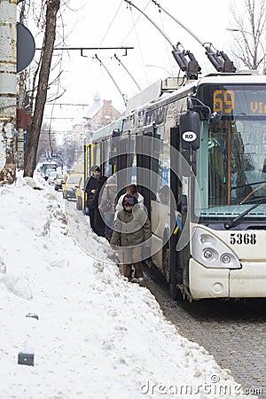 Passengers forced to walk on road after getting off the trolleybus because the local services didn't cleared the station of Editorial Stock Photo