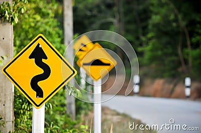 Traffic alerts downhill slope. Reduce speed and use a lower gear Stock Photo