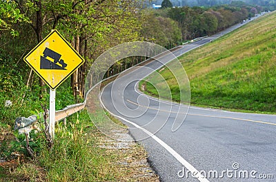 Traffic alerts downhill slope. Stock Photo