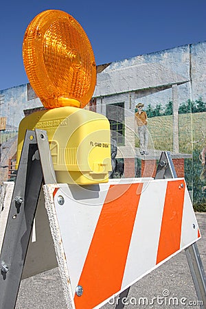 Traffic barricade set against a painted wall Stock Photo