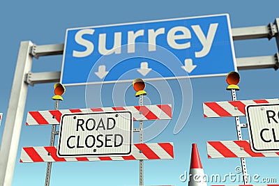 Traffic barricades near Surrey city traffic sign. Lockdown in Canada conceptual 3D rendering Stock Photo