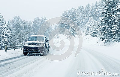 Traffic car on winter road in snow blizzard Stock Photo