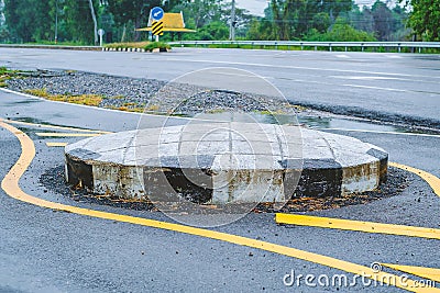 Traffic circle on the road, a junction which traffic moves in one direction around a central island Stock Photo