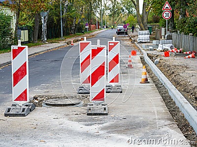 Traffic constraints during street repairs, warning signs Stock Photo