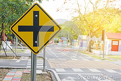 Traffic crossroads. A road sign warns of an intersection ahead. Stock Photo