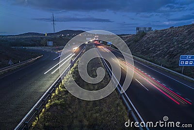 Traffic at dusk crossing the Autovia A-5, km 341 Stock Photo