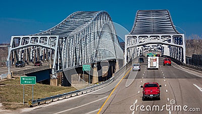 Traffic flows from Jefferson City Missouri across the Missouri River on U.S. 54/63 - Missouri River Bridge Editorial Stock Photo