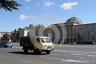 Traffic flows past the Town Hall on Stalin Square in Gori, Georgia Editorial Stock Photo