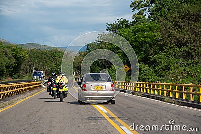 Traffic on a highway in the Colombian countryside. Editorial Stock Photo