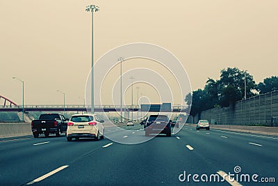 Cars on freeway road at evening in city country. Stock Photo