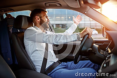Traffic jam - stressed businessman driving car Stock Photo