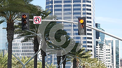 Traffic light and caution sign, road intersection in USA. Transportation safety, rules and regulations symbol. Driveway crossing Stock Photo