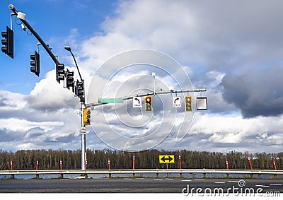Traffic light at an intersection with an arrow indicating the permitted direction of movement Stock Photo
