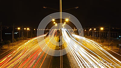 Traffic light in the outer city,light trace,speed light background. Stock Photo