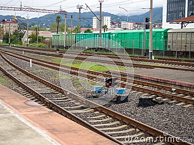 Traffic light on the railroad. Semaphore at the paths. Train station Stock Photo