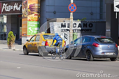 Biker and cars in traffic in Bucharest city Editorial Stock Photo