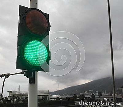 Traffic light shows green signal on a bridge Stock Photo