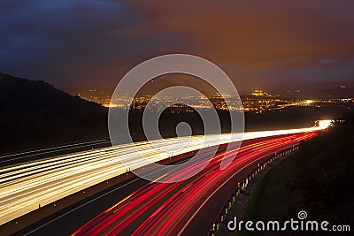 Traffic lights, car lights at night on the road Stock Photo