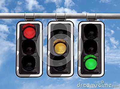 Traffic lights - red yellow green against sky Stock Photo