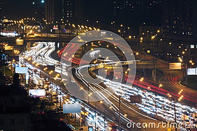 Traffic with motion cars on multilevel highway Editorial Stock Photo