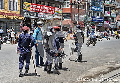 Traffic policeman, talking with the other policemans, in time of protests in Kathmandu Editorial Stock Photo