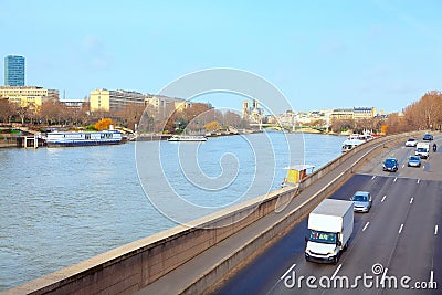 Traffic on riverside road next to the Seine River Stock Photo