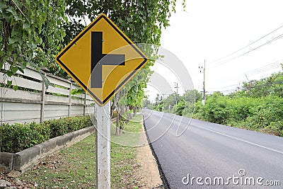 Traffic road sign yellow right intersections ahead. Stock Photo