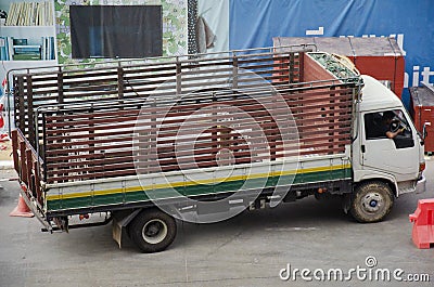 Traffic road and thai people driving truck and stop waiting entrance to inside construction side for sending material and steel Editorial Stock Photo