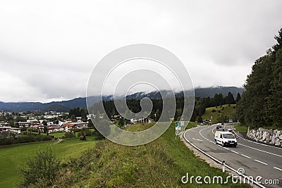 Traffic road with view landscape of alpine and cityscape of Reutte city Editorial Stock Photo