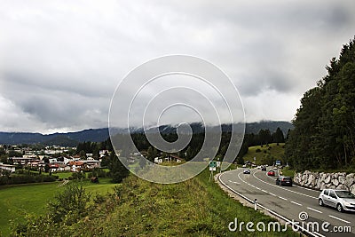 Traffic road with view landscape of alpine and cityscape of Reutte city Editorial Stock Photo