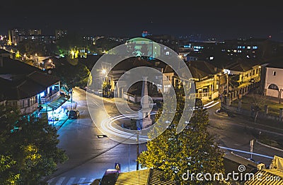 Traffic on roundabout street in city of Vranje at night Editorial Stock Photo