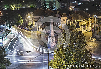 Traffic on roundabout street in city of Vranje at night Editorial Stock Photo