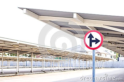 Traffic sign on empty car parking lot with roof Stock Photo