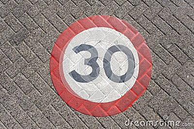 A traffic sign of 30km/h speed limit zone sign on a street Stock Photo