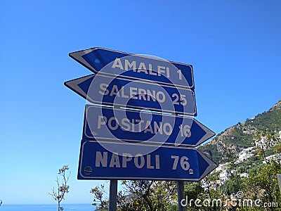 Traffic signs in Italy direction sign. Picturesque nature on the Amalfi coast. Stock Photo