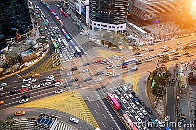 Traffic speeds through an intersection in Gangnam.Gangnam is an affluent district of Seoul. Korea. Stock Photo